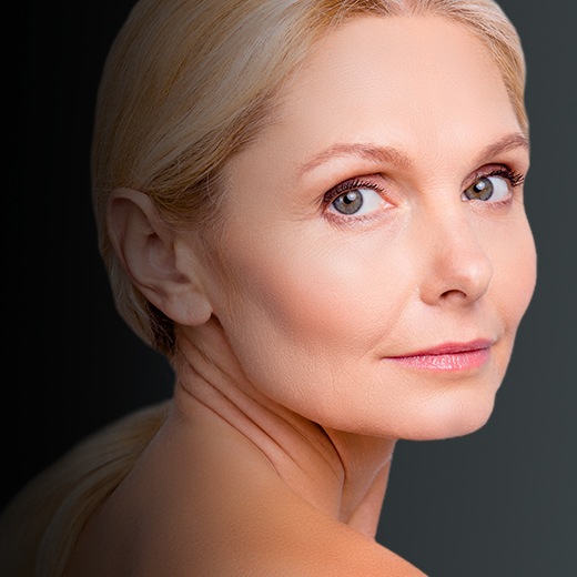 Womens_Health_Patient_Thumbnail Photo of middle-aged woman's face showing clear skin, with chin, cheeks, nose and chin all free of facial veins following vein removal treatment.